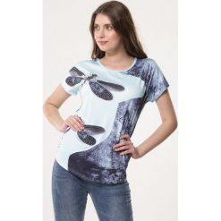 Niebieska Bluzka Perspicuity. Niebieskie bluzki damskie Born2be, xl, z aplikacjami, z dzianiny, z okrągłym kołnierzem, z krótkim rękawem. Za 39,99 zł.