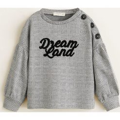 Mango Kids - Bluza dziecięca Gretel 80-104 cm. Czarne bluzy dziewczęce marki Mango Kids, z aplikacjami, z elastanu, bez rękawów, bez kaptura. W wyprzedaży za 45,90 zł.
