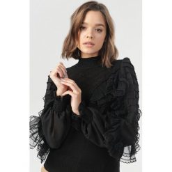 Czarny Sweter Adriama. Czarne swetry damskie Born2be, s, bez wzorów, bez rękawów, bez kaptura. Za 139,99 zł.