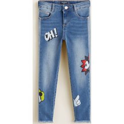 Mango Kids - Jeansy dziecięce Mickey 110-164 cm. Niebieskie rurki dziewczęce Mango Kids, z aplikacjami, z bawełny. Za 129,90 zł.
