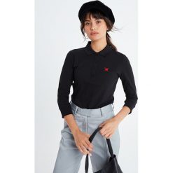 Koszulka polo w kolorze czarnym. Czarne koszulki damskie xxl, polo. W wyprzedaży za 79,95 zł.