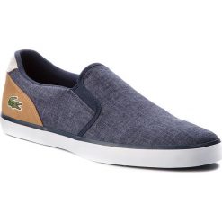 Tenisówki LACOSTE - Jouer Slip On 218 1 Cam 7-35CAM0050NT9 Nvy/Lt Tan. Niebieskie tenisówki męskie Lacoste, z gumy. W wyprzedaży za 259,00 zł.