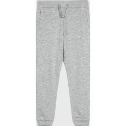 Guess Jeans - Spodnie dziecięce 118-175 cm. Niebieskie spodnie dziewczęce Guess Jeans, z aplikacjami, z elastanu. Za 99,90 zł.