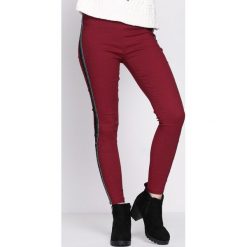 Bordowe Legginsy Rousing. Czerwone legginsy damskie marki Born2be, m, z dzianiny. Za 44,99 zł.