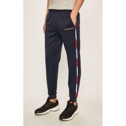 Tommy Sport - Spodnie. Niebieskie spodnie męskie Tommy Sport, s, bez wzorów, z poliesteru, sportowe. Za 399,90 zł.