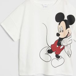 Mango Kids - T-shirt dziecięcy Mgossip 116-164 cm. Białe bluzki dziewczęce Mango Kids, z nadrukiem, z bawełny, z okrągłym kołnierzem, z krótkim rękawem, krótkie, bez kaptura. Za 59,99 zł.