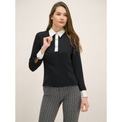 Bluzka TOMMY HILFIGER ZENDAYA WW0WW25505. Czarne bluzki damskie TOMMY HILFIGER, bez wzorów, z poliesteru, bez kołnierzyka, bez rękawów. W wyprzedaży za 349,00 zł.
