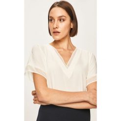 Dkny - Bluzka. Białe bluzki damskie DKNY, s, bez wzorów, z elastanu, biznesowe, bez kołnierzyka, z krótkim rękawem. W wyprzedaży za 279,90 zł.