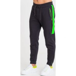 SPODNIE DRESOWE Emporio Armani. Czarne spodnie męskie Emporio Armani, na imprezę, s, z aplikacjami, z dresówki. Za 926,10 zł.