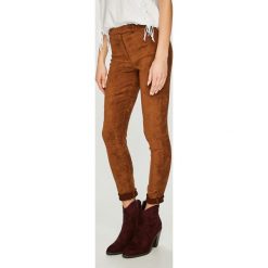 Answear - Legginsy Orient Express. Żółte legginsy marki ANSWEAR, s, z materiału. Za 129,90 zł.