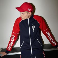 Rozpinana bluza typu track jacket z kolekcji Progress - Granatowy. Niebieskie bluzy męskie Cropp, s, bez wzorów, bez kołnierzyka, bez rękawów, bez kaptura. Za 119,99 zł.