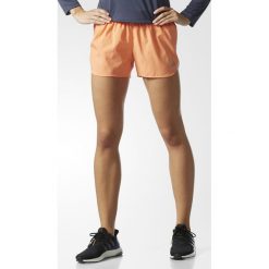 Spodenki adidas Response Shorts W Pomarańczowe. Pomarańczowe spodenki sportowe damskie Adidas, bez wzorów, do biegania. Za 39,99 zł.