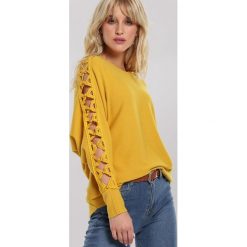 Żółty Sweter Olympia. Żółte swetry damskie other, s, bez wzorów, casualowe, bez rękawów, bez kaptura. Za 89,99 zł.