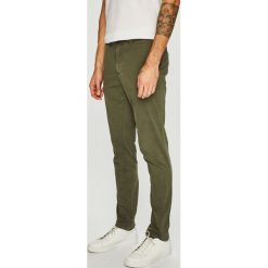Tommy Hilfiger - Spodnie. Żółte spodnie męskie TOMMY HILFIGER, na co dzień, bez wzorów, z elastanu, casualowe. W wyprzedaży za 299,90 zł.