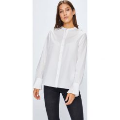 Tommy Hilfiger - Koszula Suri. Białe bluzki damskie marki TOMMY HILFIGER, z bawełny, casualowe, ze stójką, z długim rękawem. W wyprzedaży za 229,90 zł.