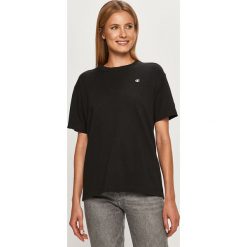 Champion - T-shirt. Czarne bluzki damskie Champion, s, bez wzorów, z bawełny, casualowe, z okrągłym kołnierzem. Za 169,90 zł.