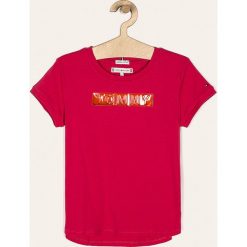 Tommy Hilfiger - T-shirt dziecięcy 128-176 cm. Pomarańczowe bluzki dziewczęce TOMMY HILFIGER, z aplikacjami, z bawełny, z okrągłym kołnierzem, z krótkim rękawem, krótkie, bez kaptura. Za 179,90 zł.