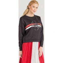BLUZA 4G LOGO Guess. Czarne bluzy damskie Guess, s, z nadrukiem, z materiału. Za 159,50 zł.