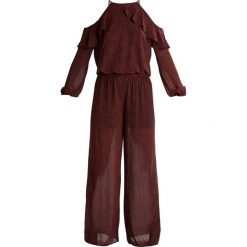 MICHAEL Michael Kors COLE COLD SHOULDER Kombinezon true red. Czerwone kombinezony damskie marki MICHAEL Michael Kors, xs, z materiału. W wyprzedaży za 576,95 zł.