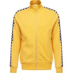 Kurtki sportowe męskie: Criminal Damage CHEQUER TRACK TOP Kurtka sportowa yellow/white