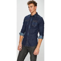 Guess Jeans - Koszula Connor. Niebieskie koszule męskie marki Guess Jeans, s, z aplikacjami, z bawełny, klasyczne, z klasycznym kołnierzykiem, z długim rękawem. W wyprzedaży za 299,90 zł.