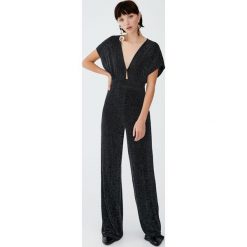 Długi metaliczny kombinezon wieczorowy. Czarne kombinezony eleganckie marki Pull&Bear, z długim rękawem, długie. Za 139,00 zł.