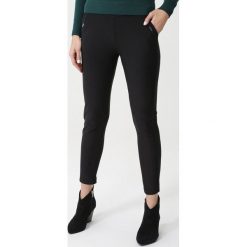 Czarne Legginsy Athelstone. Czarne legginsy damskie Born2be, s, bez wzorów, z dzianiny, eleganckie. Za 79,99 zł.