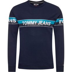 Bluza Tommy Jeans Tjm Band Logo Crew DM0DM07894. Niebieskie bluzy męskie Tommy Jeans, xl, bez wzorów, z bawełny, bez kołnierzyka, bez rękawów, bez kaptura. Za 389,00 zł.