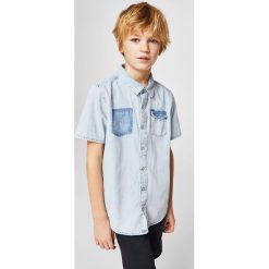 Mango Kids - Koszula dziecięca Mario 110-164 cm. Szare koszule męskie jeansowe marki Mango Kids, z klasycznym kołnierzykiem, z krótkim rękawem. W wyprzedaży za 39,90 zł.