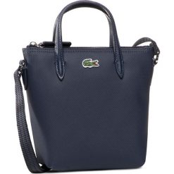 Torebka LACOSTE - Xs Shopping Cross Bag NF2609PO Eclipse 141. Niebieskie torebki klasyczne damskie Lacoste, bez wzorów, ze skóry ekologicznej, klasyczne, bez dodatków. Za 319,00 zł.