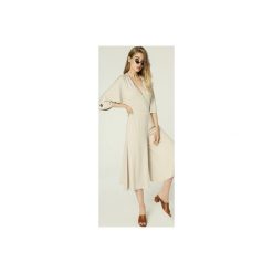 Kombinezon Janis - jasny beż. Brązowe kombinezony damskie marki Madnezz, s, bez wzorów, z elastanu, eleganckie, bez kołnierzyka, bez rękawów. Za 359,00 zł.