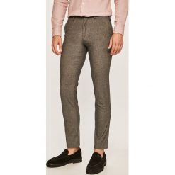 Tommy Hilfiger - Spodnie. Szare spodnie męskie TOMMY HILFIGER, bez wzorów, z elastanu. W wyprzedaży za 239,90 zł.