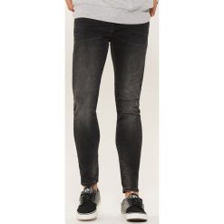 Jeansy skinny - Czarny. Czarne jeansy męskie regular House, z jeansu. Za 99,99 zł.