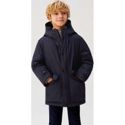Mango Kids - Kurtka dziecięca Fast 110-164 cm. Niebieskie kurtki chłopięce Mango Kids, bez wzorów, z poliesteru, krótkie, z kapturem. Za 199,90 zł.