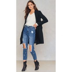 Dance & Marvel Jeansy z rozdarciami - Blue. Niebieskie jeansy damskie marki Dance & Marvel, z motywem z bajki, z denimu. W wyprzedaży za 110,48 zł.