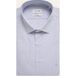 Calvin Klein - Koszula. Niebieskie koszule męskie Calvin Klein, bez wzorów, z elastanu, eleganckie, z klasycznym kołnierzykiem, z długim rękawem. Za 349,90 zł.