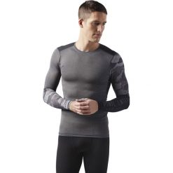 KOSZULA REEBOK AC GRAPHIC LS COMP DGREYH. Szare koszule męskie na spinki marki Reebok, m, moro, z materiału, z długim rękawem. Za 139,99 zł.