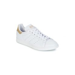 Buty adidas STAN SMITH. Białe trampki i tenisówki damskie marki Adidas, bez wzorów, bez zapięcia. Za 335,20 zł.
