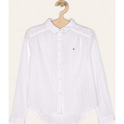Tommy Hilfiger - Koszula dziecięca 128-176 cm. Białe bluzki dziewczęce TOMMY HILFIGER, bez wzorów, z bawełny, bez kołnierzyka, z długim rękawem, długie, bez kaptura. Za 339,90 zł.