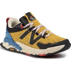 Buty NEW BALANCE - MTHIERY5 Żółty. Żółte buty sportowe męskie New Balance, z tworzywa sztucznego, bez zapięcia, do biegania. Za 529,00 zł.