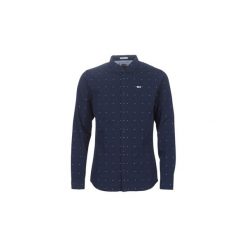 Koszule z długim rękawem Tommy Jeans TJM NOVELTY DOBBY SHIRT. Niebieskie koszule męskie Tommy Jeans, s, bez wzorów, z jeansu, bez kołnierzyka, z długim rękawem. Za 359,00 zł.