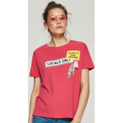 T-shirty damskie: T-shirt z aplikacją – Pomarańczo