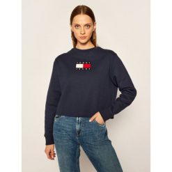 Bluza Tommy Jeans Tjw Flag Crew DW0DW08548. Niebieskie bluzy damskie Tommy Jeans, xs, bez wzorów, z jeansu, bez rękawów, bez kaptura. Za 539,00 zł.
