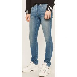 Armani Exchange - Jeansy J13. Niebieskie jeansy męskie Armani Exchange, bez wzorów. Za 479,90 zł.