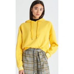 Bluza z kapturem - Żółty. Żółte bluzy damskie z kapturem marki Sinsay, s. Za 49,99 zł.