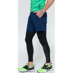 Spodenki treningowe męskie SKMF300 - granatowy. Niebieskie spodenki i szorty męskie 4f, m, bez wzorów, z elastanu. W wyprzedaży za 39,99 zł.