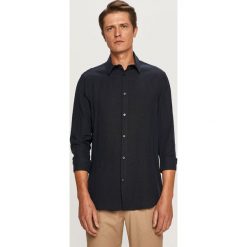 Marciano Guess - Koszula. Niebieskie koszule męskie MARCIANO GUESS, z aplikacjami, z lyocellu, eleganckie, z klasycznym kołnierzykiem, z długim rękawem. W wyprzedaży za 319,90 zł.
