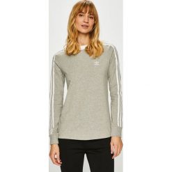 Adidas Originals - Bluzka. Szare topy damskie adidas Originals, s, bez wzorów, z elastanu, z okrągłym kołnierzem. W wyprzedaży za 129,90 zł.