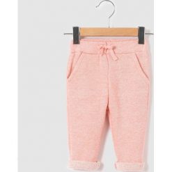 Spodnie sportowe jogpant, z moltonu melanżowego 1 miesiąc - 3 lata. Różowe spodnie niemowlęce marki La Redoute Collections, z bawełny. Za 67,16 zł.
