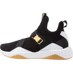 Puma DEFY MID VARSITY Obuwie treningowe black/metallic gold. Czarne buty sportowe damskie marki Puma, z materiału. Za 459,00 zł.